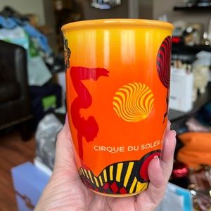 Cirque Du Soleil Orange/Black Mug.  No chips or cracks!